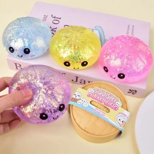 Mini squishies dumpling à paillettes tenus en main - Planete Jouets France